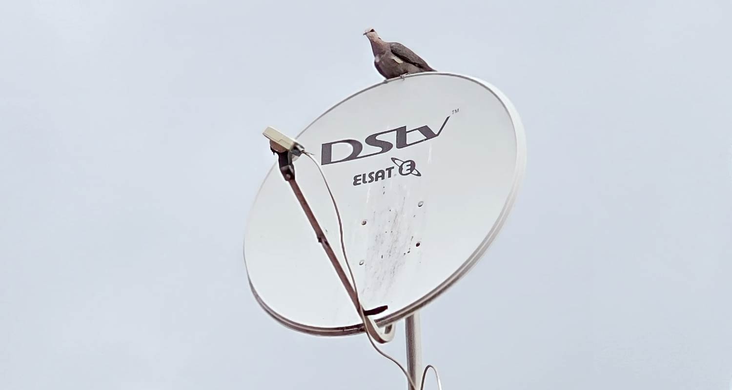 Satellite dish installation against a clear sky